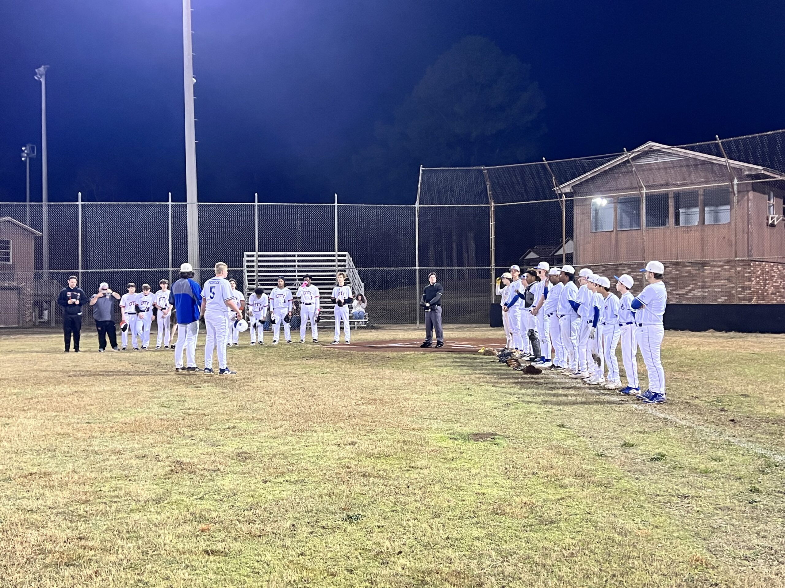 HC Angels lined up for prayer before their doubleheader