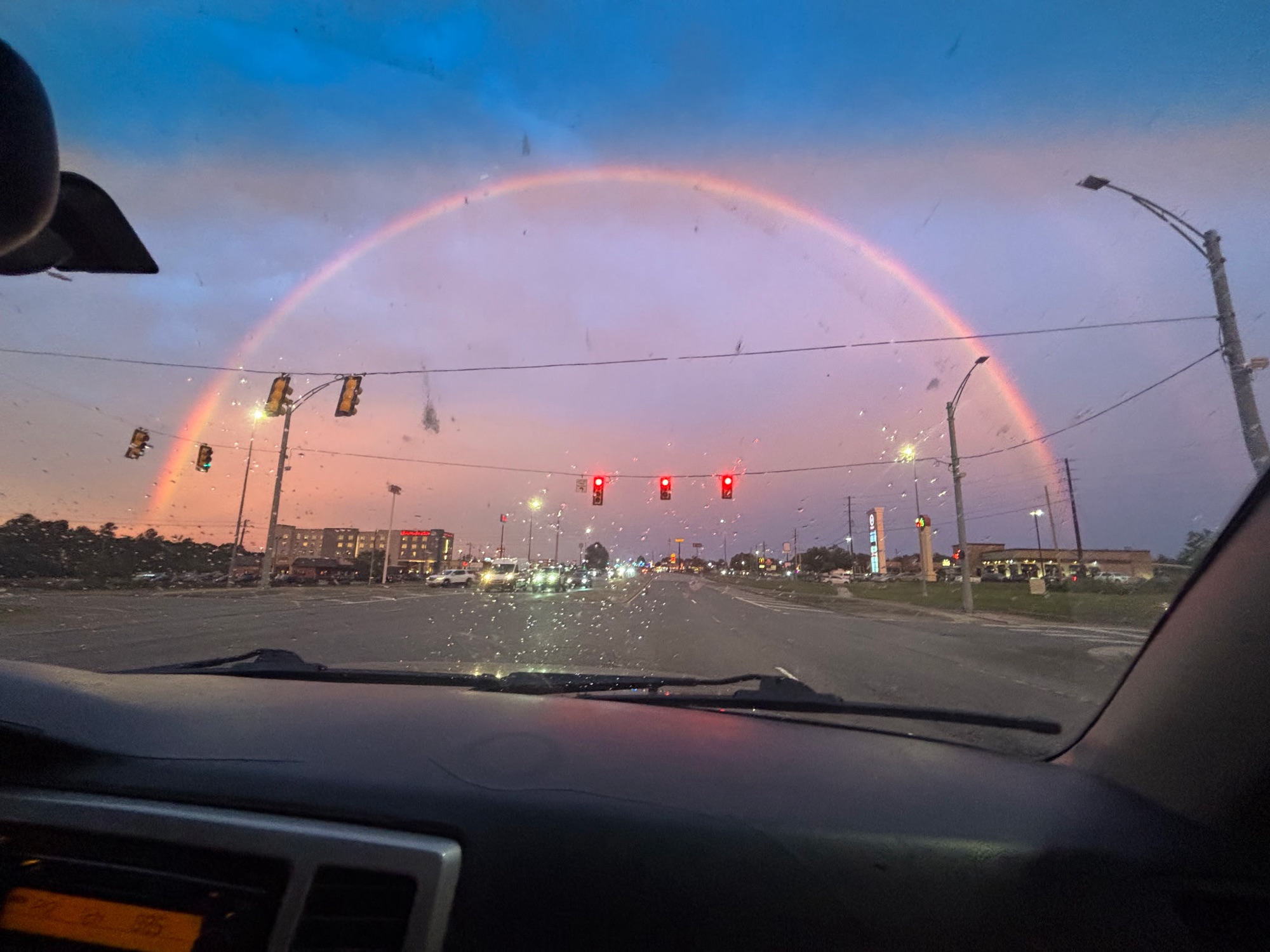 Rainbow stretching across the sky as Drake heads into Birmingham after the Huntsville mower trip