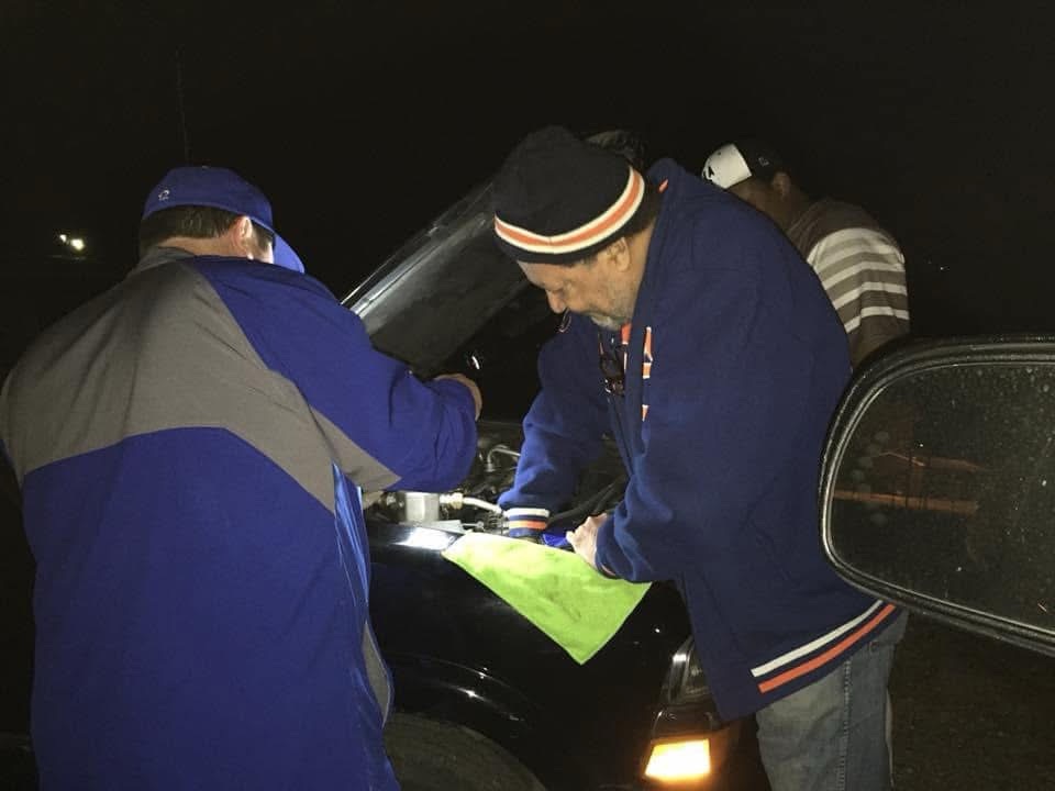 Coach Clay Wingard helping East Central Patriots parents with their vehicle after a doubleheader in 2017