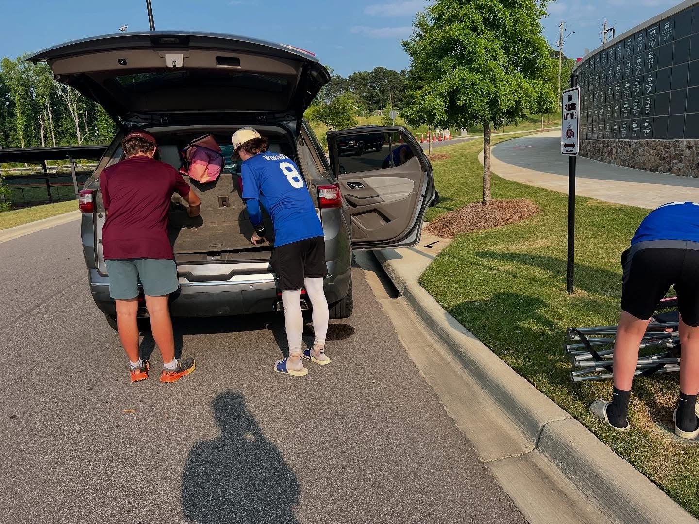 Kent Wingard helping retrieve the spare tire