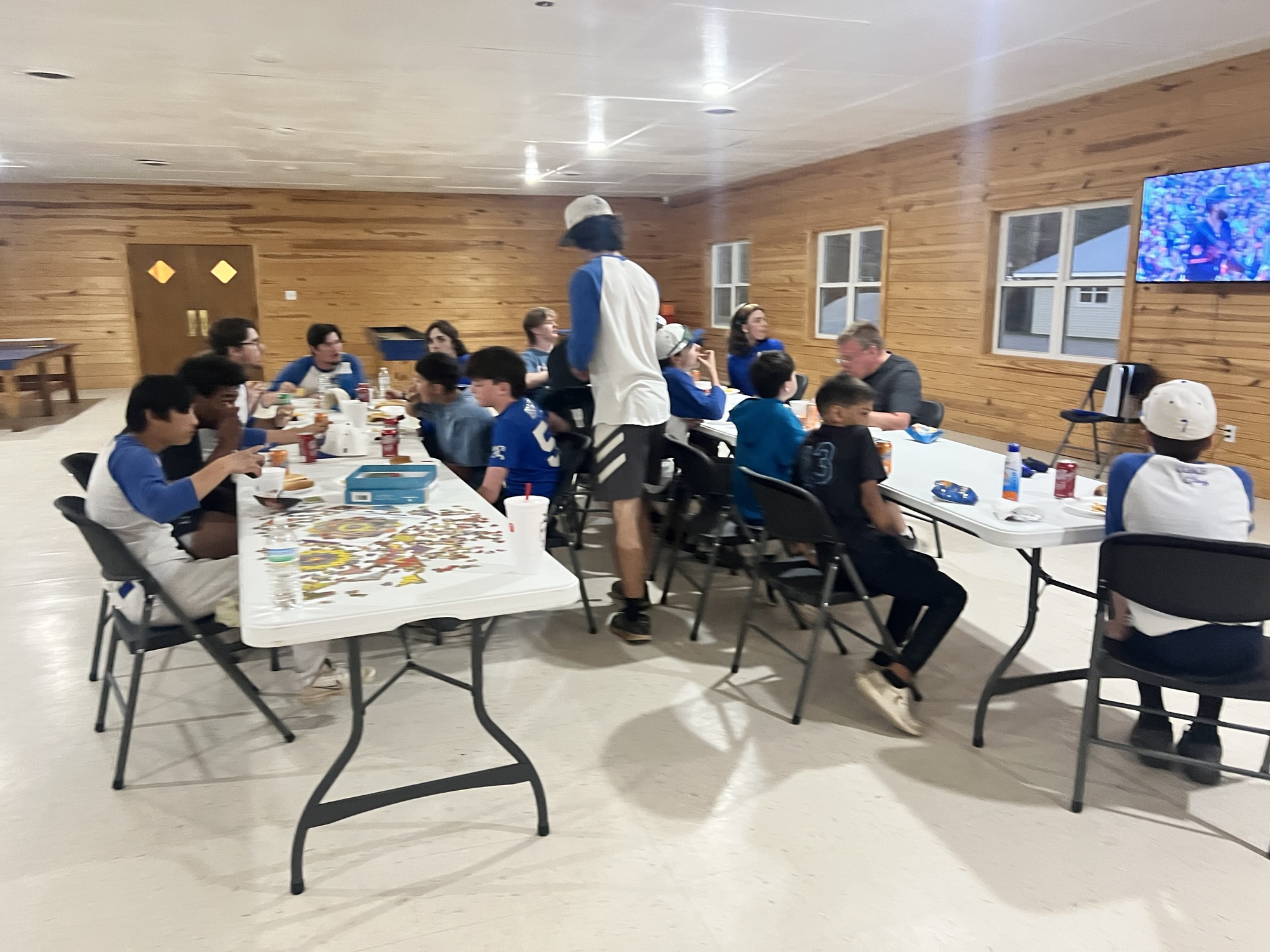 HC Angels and families sharing a meal together