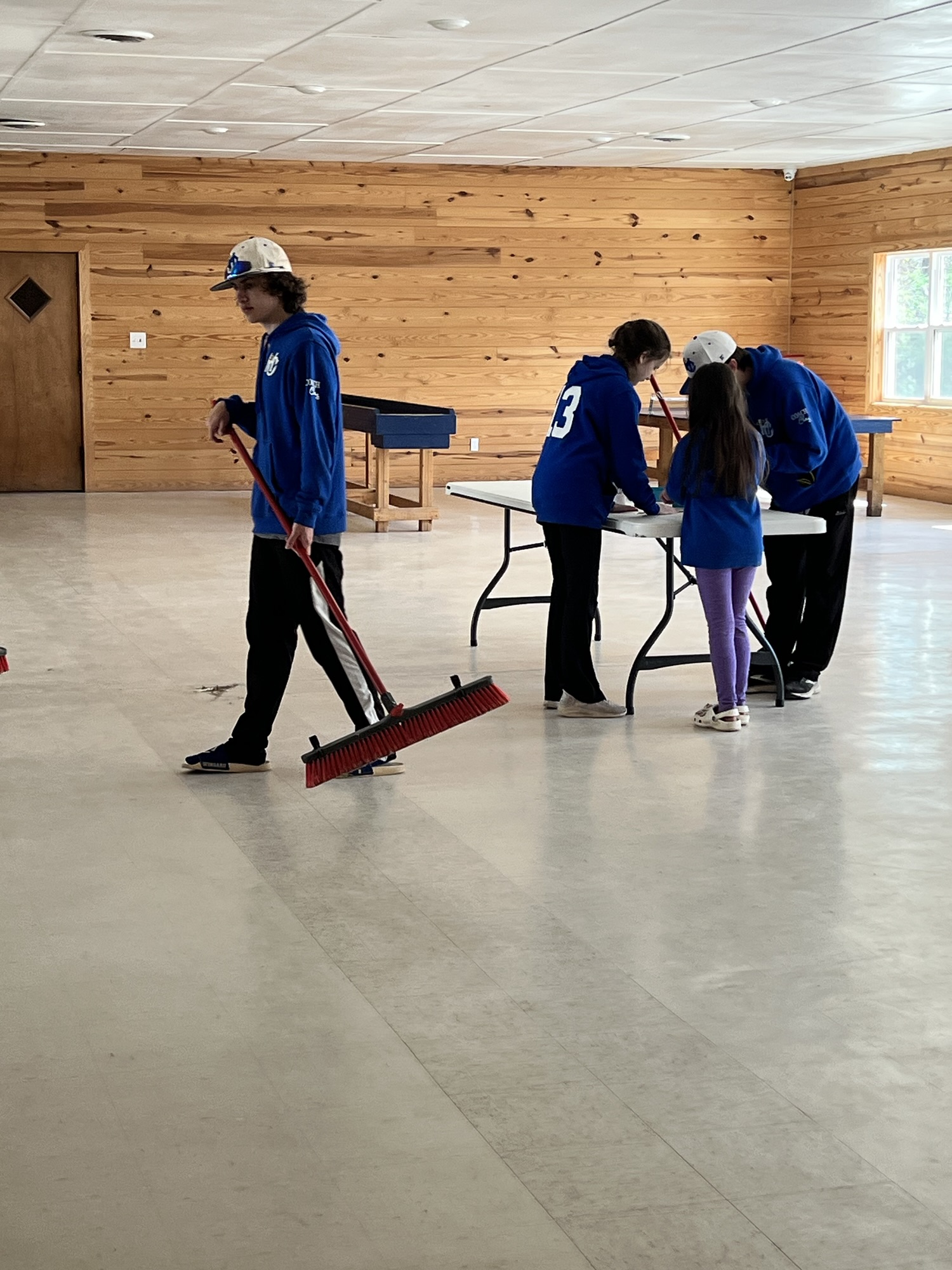 HC Angels helping sweep and clean up after retreat activities